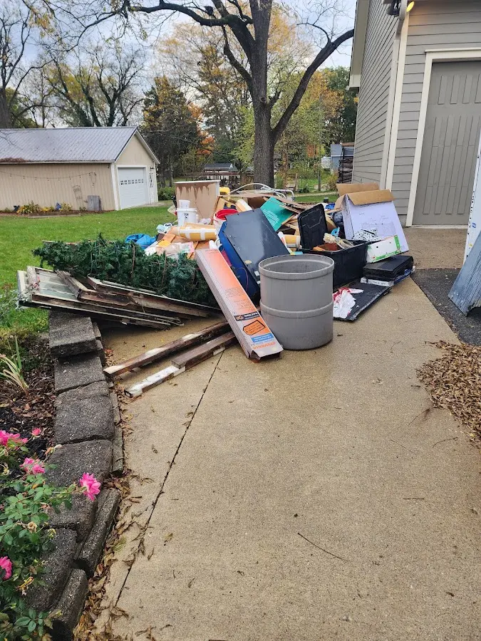 Dumpster being loaded with debris for Commercial Dumpster Rental in Columbiana